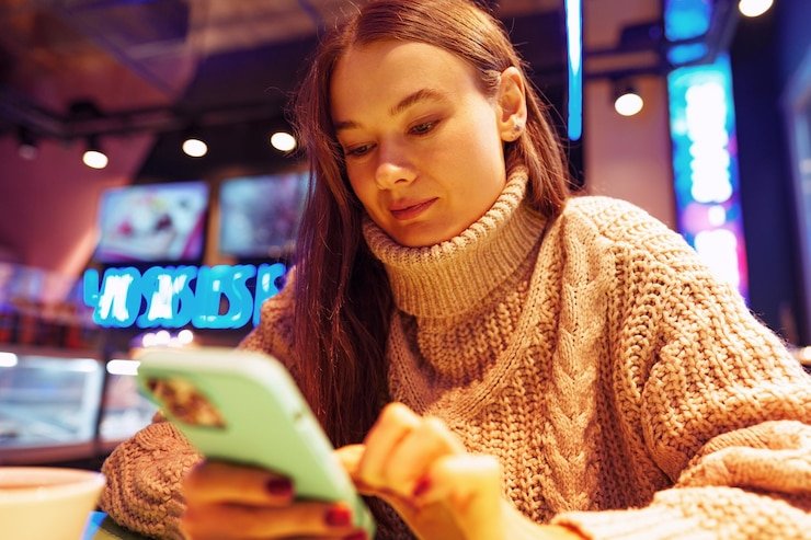 Filipino player browsing 777ph promotions on mobile phone